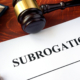 Document with title subrogation and gavel.