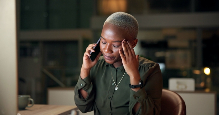 Night, business woman and frustrated with phone call, planning and brainstorming with overtime. Black person, employee and accountant with negotiation, stress and project proposal consulting deadline