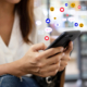 Woman sitting in a coffee shop using a smartphone