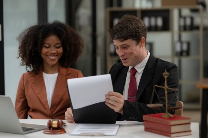 Partner lawyers or attorneys discussing a contract agreement. Successful businessmen have a contract in place to protect it,signing of modest agreements form in office