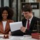 Partner lawyers or attorneys discussing a contract agreement. Successful businessmen have a contract in place to protect it,signing of modest agreements form in office