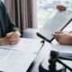 Lawyer signing a legal document next to a judge's gavel, representing a punitive damages claim in California